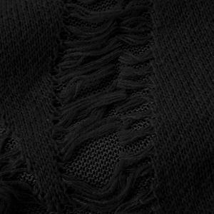 Detail view of black chunky knit fabric featuring distressed ripped edges and fringe texture
