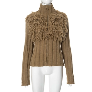 Close-up of brown knit cardigan featuring unique long loop fringe textures and metal zipper