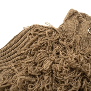 Detail of brown chunky knit sweater showing intricate fringe textures and soft yarn layers