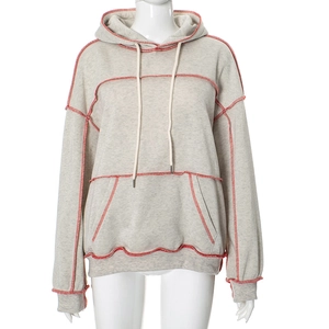Detail of light grey hoodie with contrast red stitching and kangaroo pocket feature