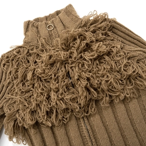 Close-up of brown knit cardigan with golden zipper pull and textured loop yarn detail