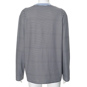 Detail view of striped long sleeve top featuring a light blue ribbed crew neckline