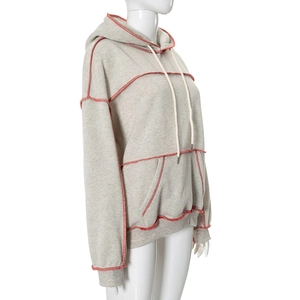 Detail of light grey hoodie with red contrast stitching and adjustable white drawstring
