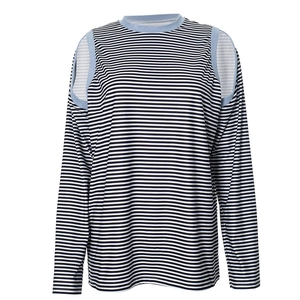 Detail of striped long sleeve top featuring blue contrast trim on cold shoulder cutout