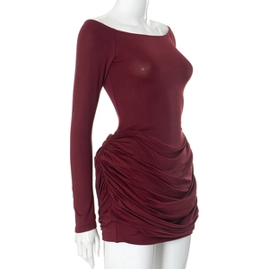 Detail view of the side ruching and pleated fabric on this burgundy bodycon dress