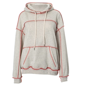 Detail of grey casual hoodie showing red contrast stitching and drawstring hood