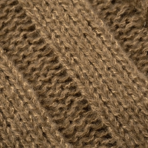 Macro texture detail of thick ribbed brown knit fabric showing soft fiber quality