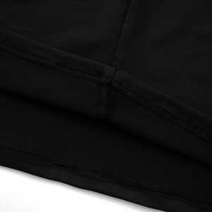 Detailed macro view of the double-needle stitching on the black knitted dress hemline