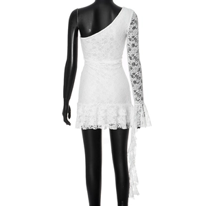 Close-up of white lace dress with one-shoulder design and flared sleeves