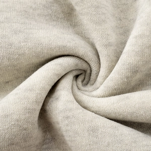 Macro shot of heather grey knitted hoodie fabric showing soft texture and weave