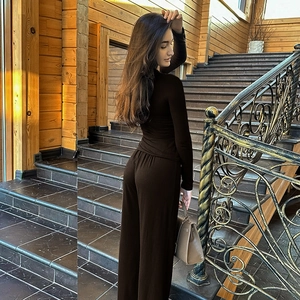 Deep brown two-piece lounge set with slim fit long sleeve top and wide-leg trousers