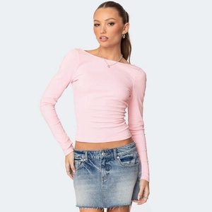 Detailed close-up of a pink long-sleeved slim fit T-shirt with elastic ribbed texture