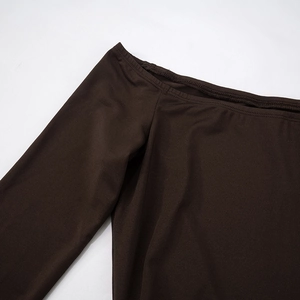 Detail of dark brown off-the-shoulder neckline and soft elastic fabric texture