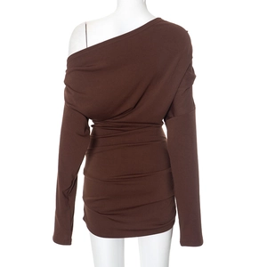 Detail view of deep brown ruched back and asymmetric hemline on a bodycon dress