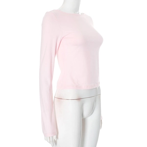 Detail of the backless design on this slim fit long sleeve pink top for women
