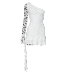 Close-up of white lace dress featuring ruffle hem and elegant sheer floral embroidery