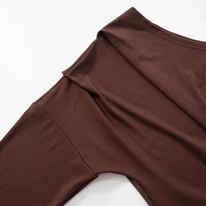 Close-up of chocolate brown knit fabric with drop shoulder and high-elastic texture