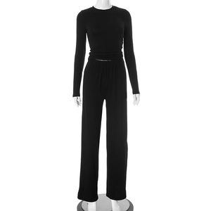 Detail view of black long sleeve round neck top and high waist wide leg pants set