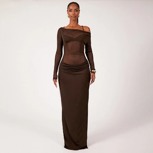Detail of dark brown sheer mesh top with elegant side waist ruching on the long skirt