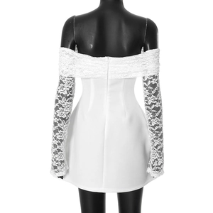 Detail of white slim lace dress featuring floral patterns and a hidden back zipper