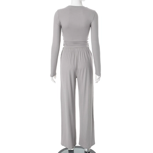 Detail view of the soft knitted fabric texture and elastic waistband of grey lounge set