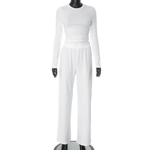 Detail of white long sleeve top and high waist wide leg pants lounge set on mannequin