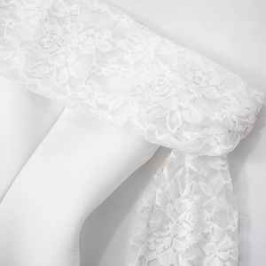 Close-up of white floral lace fabric on high waist slim fit long sleeve mini dress