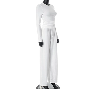 Detail of white long sleeve top and wide leg pants set in soft elastic fabric