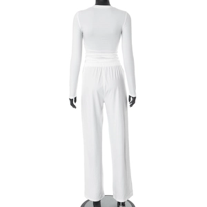 Back view of white two-piece lounge set with long sleeve top and wide leg pants