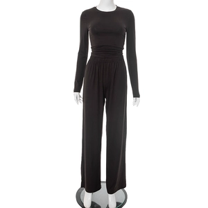 Detail view of coffee brown loungewear set with pleated top and high waist wide leg pants