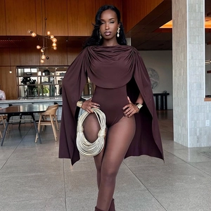 Detail of the chocolate brown draped bodysuit featuring an elegant cape-style shoulder design