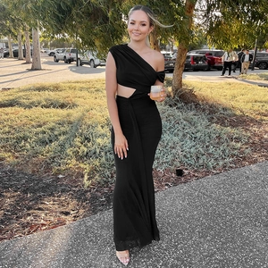 Elegant black one-shoulder maxi dress with waist cut-out and asymmetric neckline