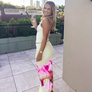 Detail of elegant summer floral two-piece set with slim camisole and long printed skirt