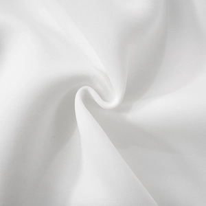 Macro shot of high-quality white lace fabric texture with elegant soft draping