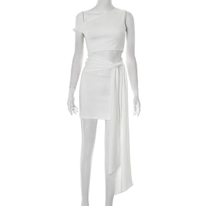 Detail of white mini dress featuring one-shoulder neckline and waist cut-out with long ties