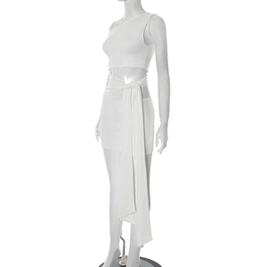 Detail of white two-piece set featuring off-shoulder top and mini skirt with waist tie