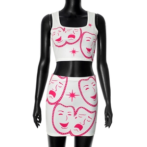 Detailed view of pink theater masks print on white ribbed knit two-piece set for women