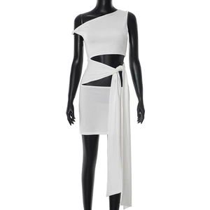 Detail of white one-shoulder mini dress featuring waist cut-out and long sash tie