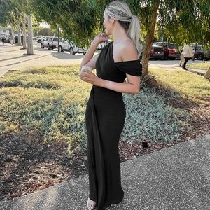 Elegant black one-shoulder maxi dress with side ruching detail and a flowing silhouette