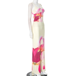 Detail of floral print on two-piece elegant summer set with camisole and slim maxi skirt