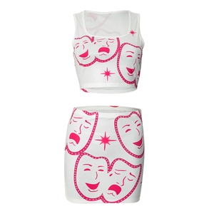 Detail of white two-piece set with pink mask prints featuring a crop top and mini skirt