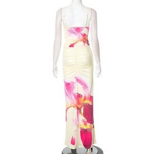 Detail of the elegant floral print and ruching detail on the back of the slim-fit maxi skirt