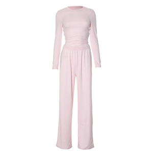 Detail view of pink long sleeve top and high waist wide leg pants with elastic waistband