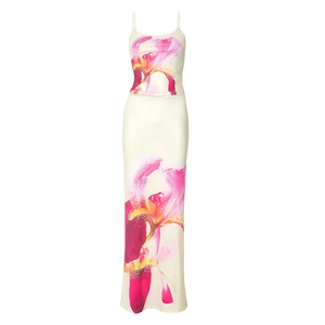 Detail of floral print on elegant summer two-piece camisole top and slim maxi skirt set