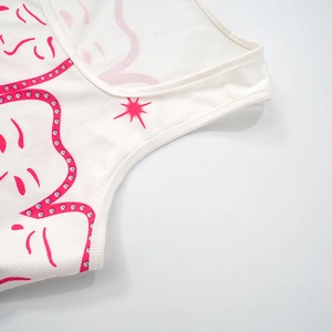 Close-up of ribbed white cotton tank top with vibrant pink Y2K style star graphic print