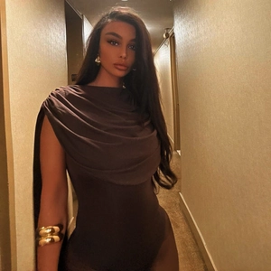 Detailed view of the draped neckline on a dark brown sleeveless bodysuit with elegant folds