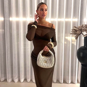Detail of off-the-shoulder mesh dress with elegant white pleated leather handbag