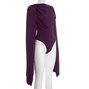 Detail of elegant plum purple bodysuit featuring cowl neck and flowing cape sleeves