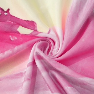 Close-up of pink and yellow gradient floral fabric texture with soft spiral twisting