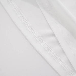 Macro shot of precise double-needle stitching on white cotton dress hemline